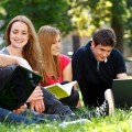 Group of college students studying at campus